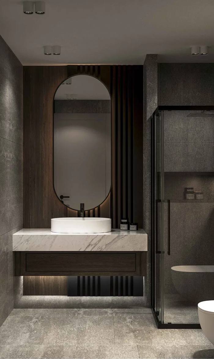 Dome bathroom with vanity, arched mirror and glass shower